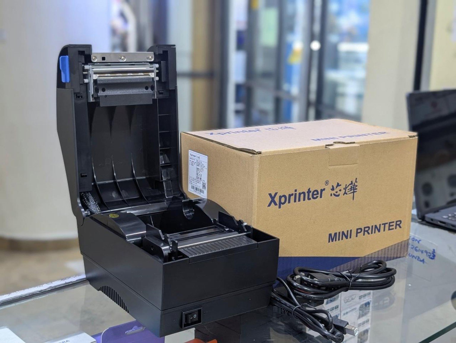Xprinter XB-330B Thermal Barcode Label Printer Kenya – Product Photo Xprinter XB-330B direct thermal barcode label printer with its branded box, lid open – Infinite Tech Kenya