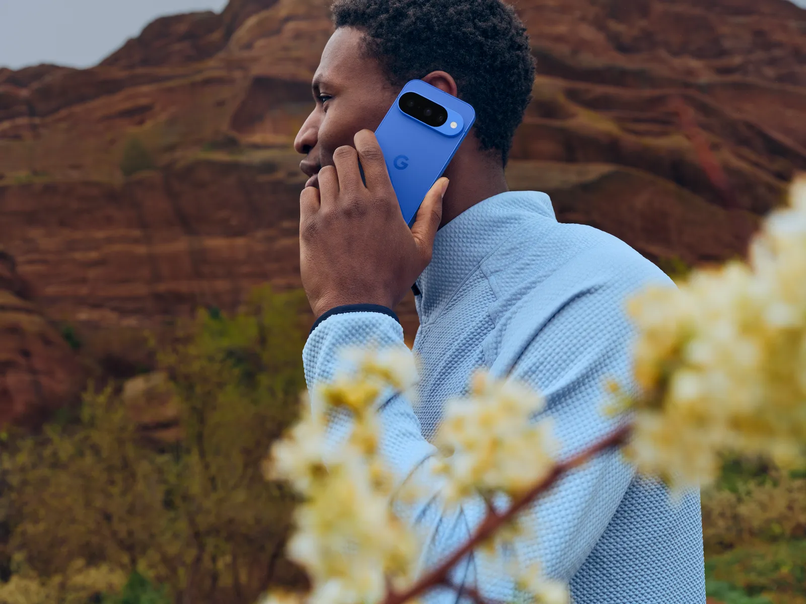 Google Pixel 10 in Indigo in use outdoors